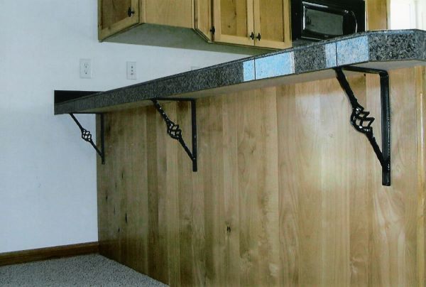 Hand-forged custom iron furniture detail