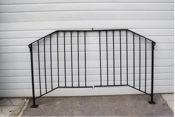 Detail of a hand-forged iron railing design with scrollwork in Nampa, Idaho