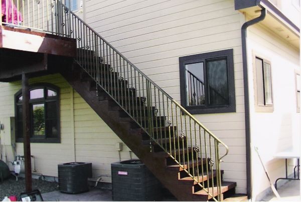 Custom iron staircase railing by Anvil Iron Works