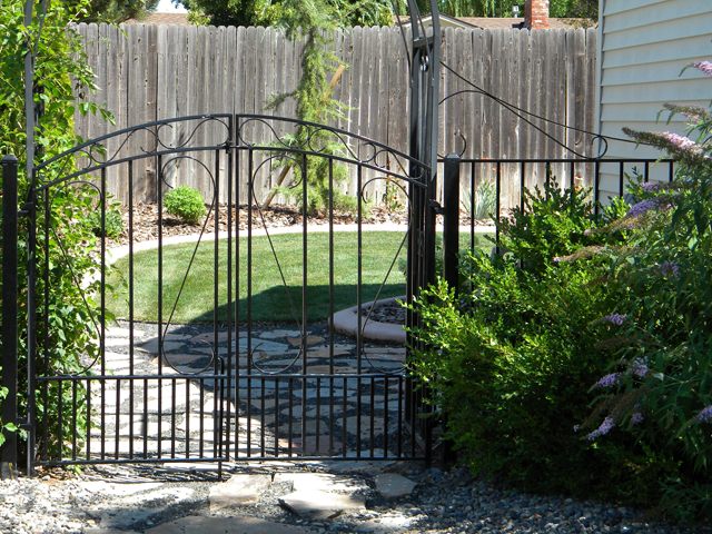 Custom wrought iron driveway gate built by Anvil Iron Works in Nampa, Idaho