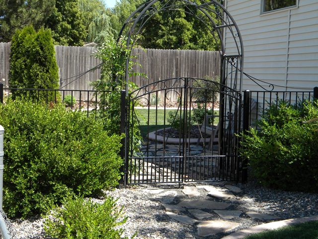 Hand-forged iron security gate with scrollwork in Nampa, Idaho