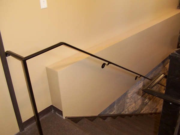 Custom interior iron stair railing installed in a Treasure Valley staircase