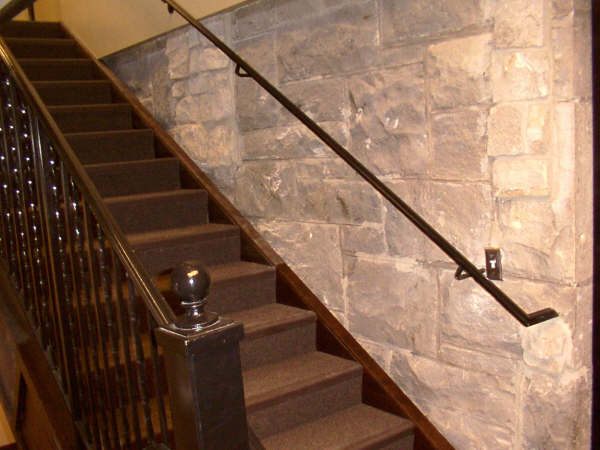 Custom hand-forged iron railing on an interior staircase near Nampa, Idaho